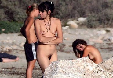 naked and having sex at the beach