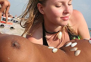 girl flashing at the beach
